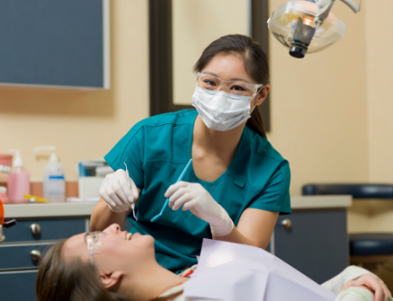 dental-application---dental-hygienist-performing-teeth-cleaning